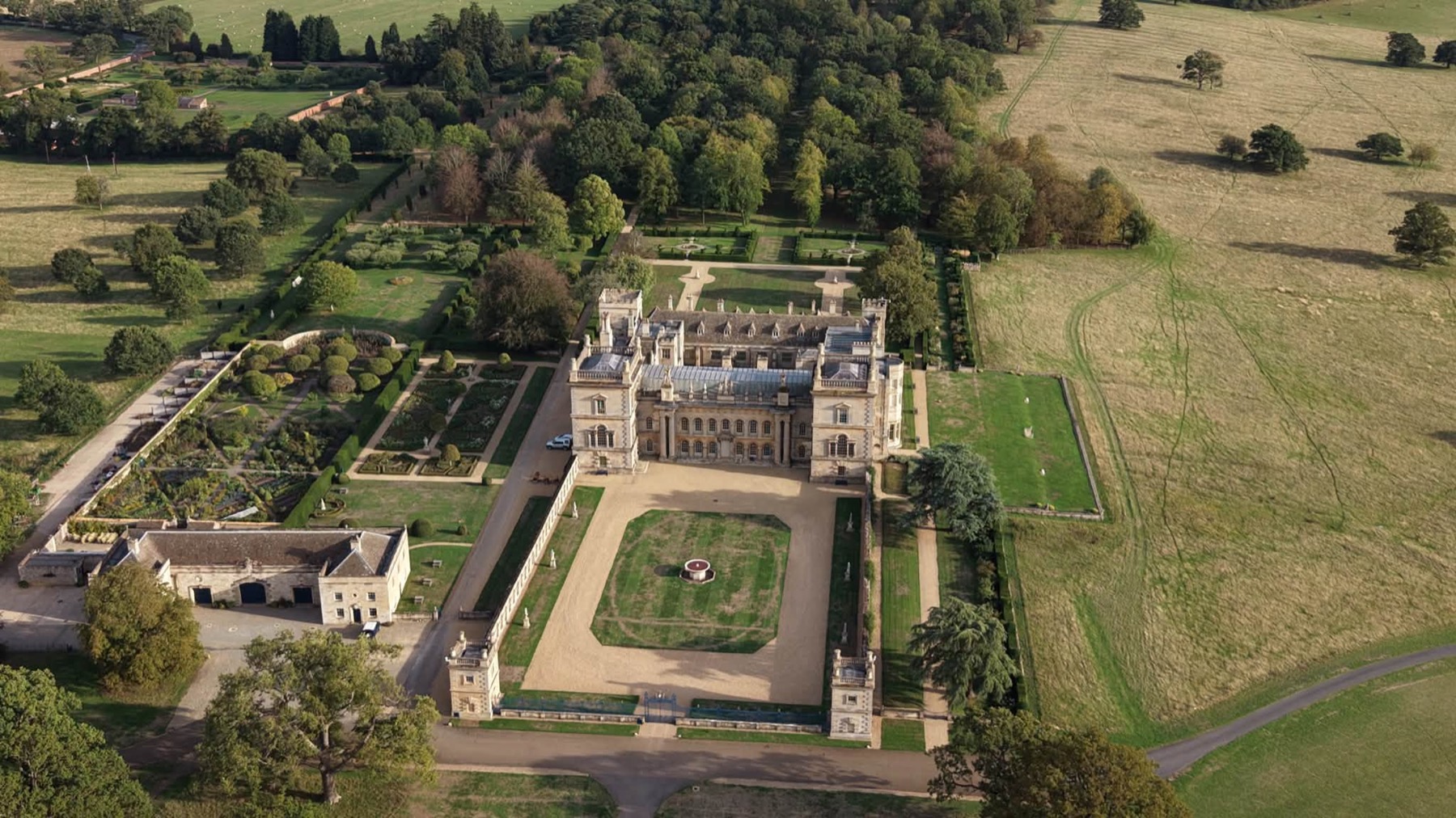 Country house with formal gardens and walled garden from above